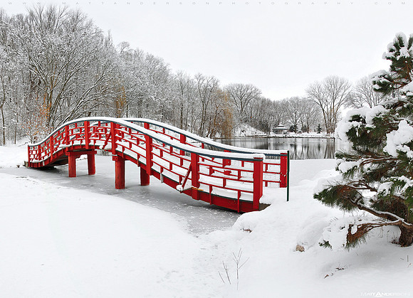 snow-covered-red-bridge